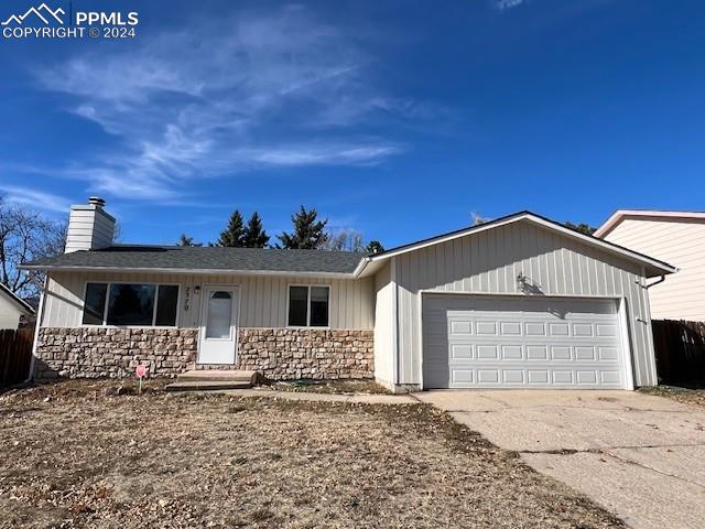 Single story home featuring a garage