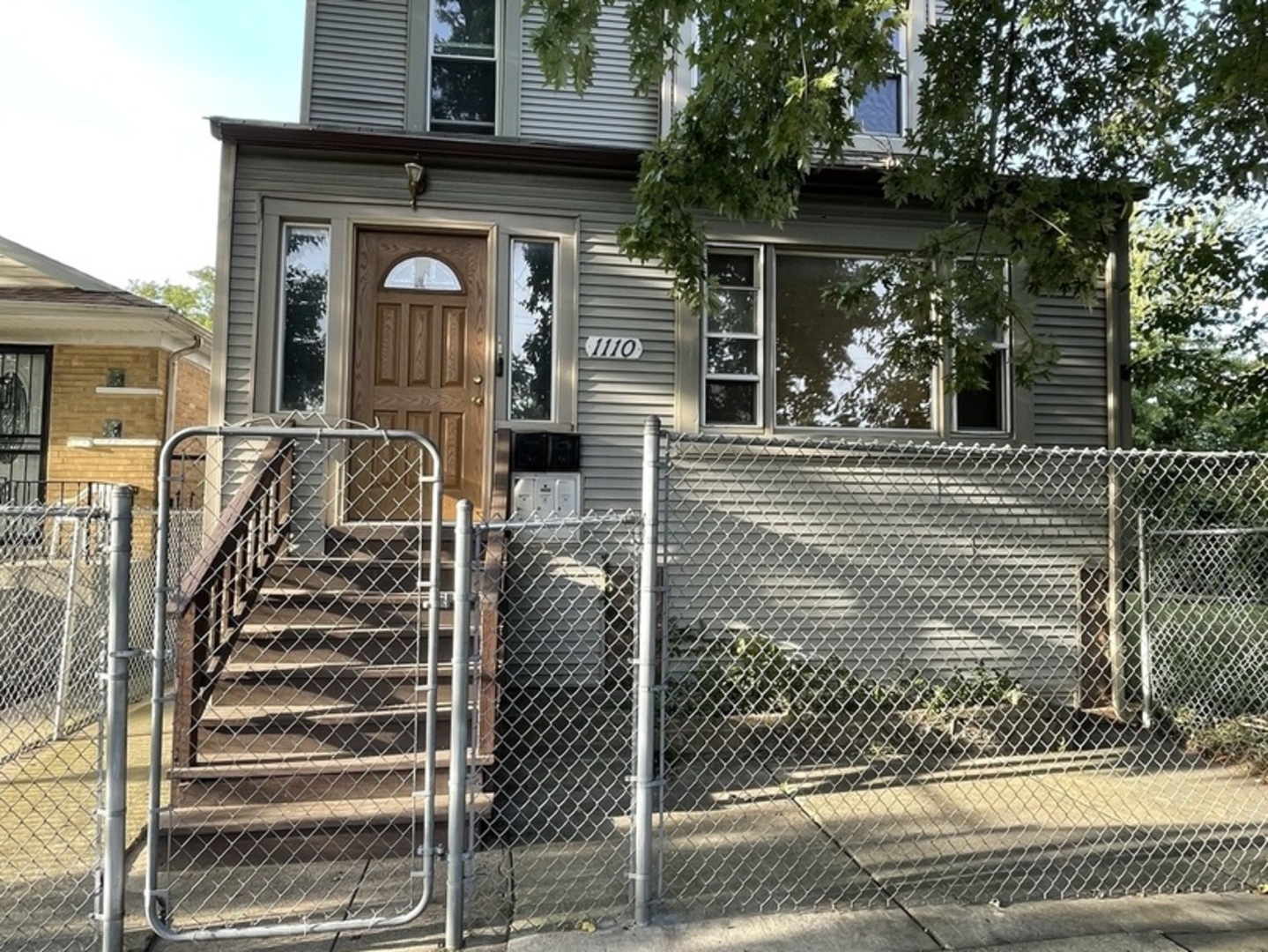 a front view of a house with stairs