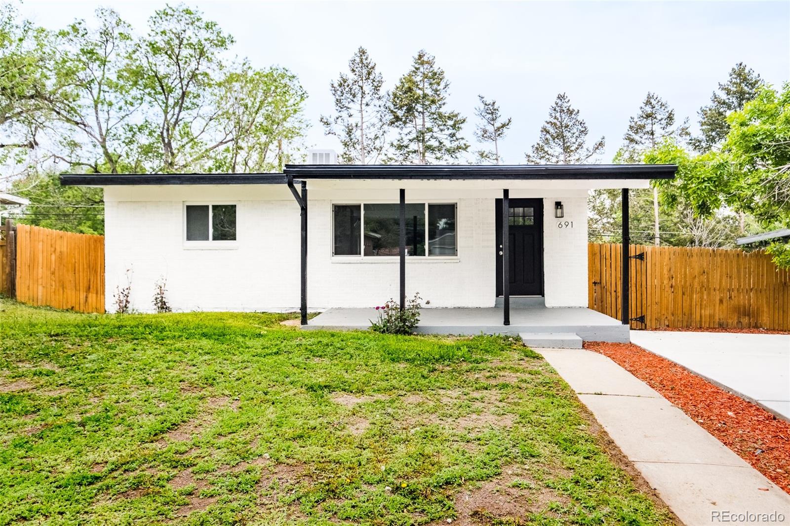 front view of a house with a big yard