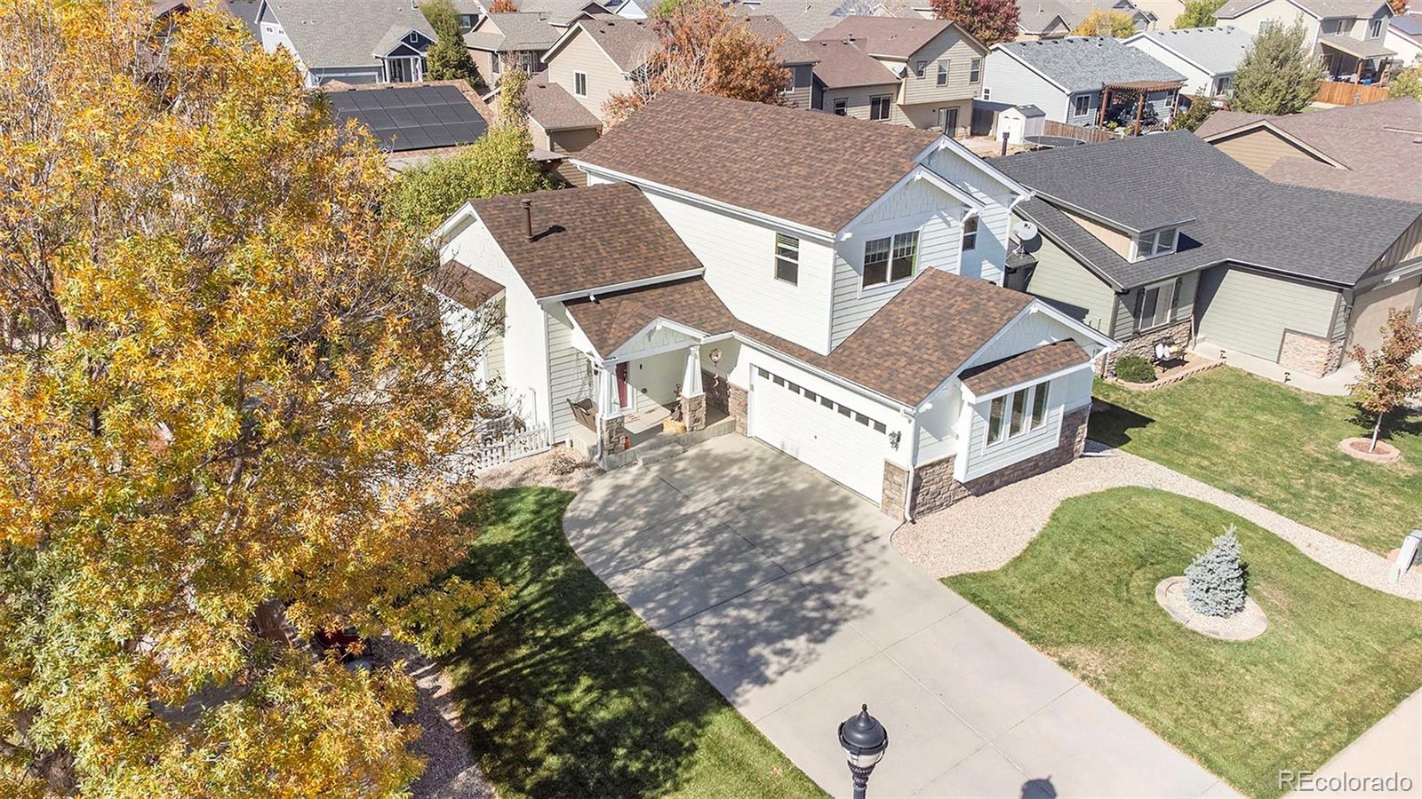 an aerial view of a house with yard