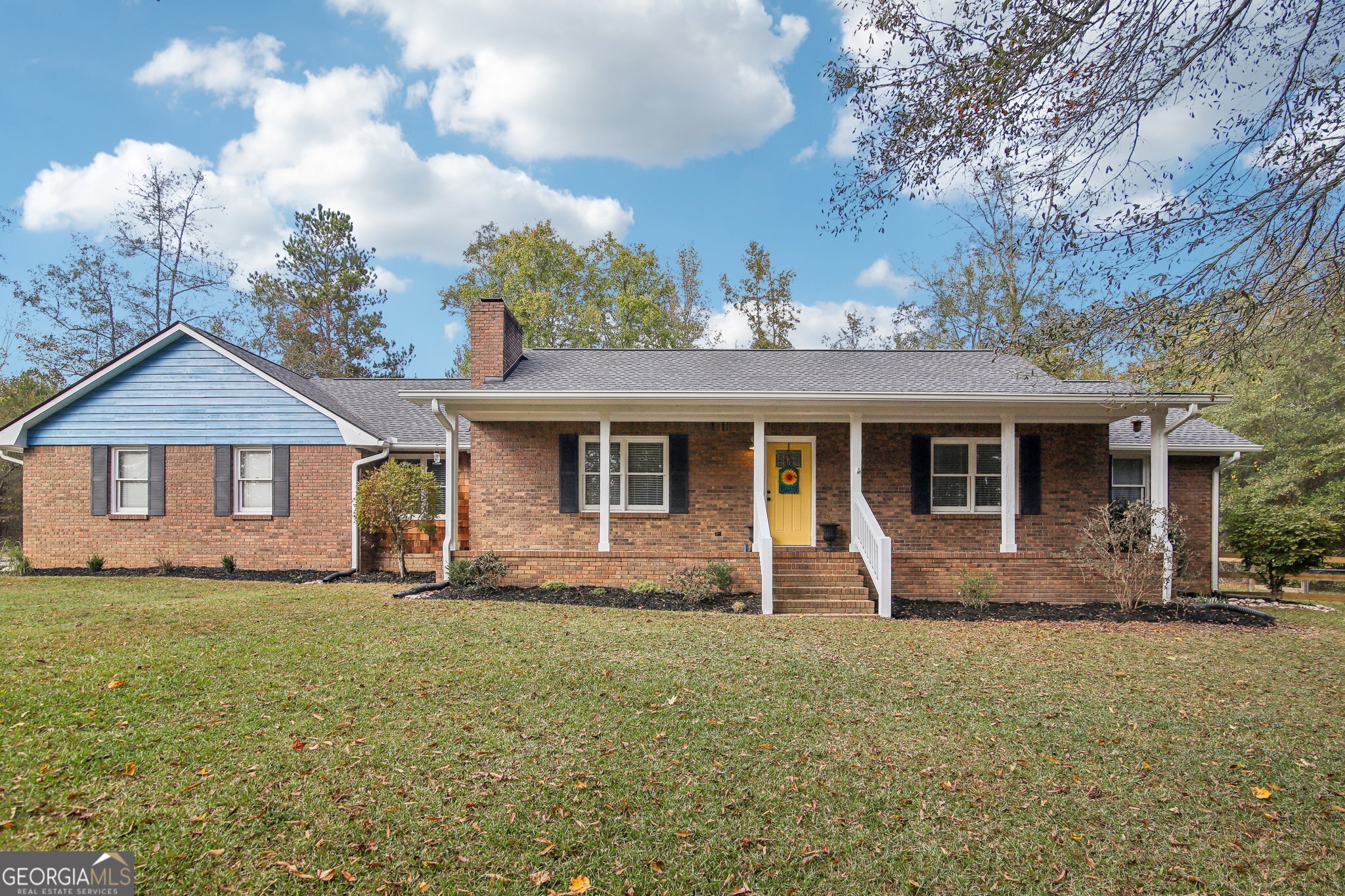 a front view of a house with a yard