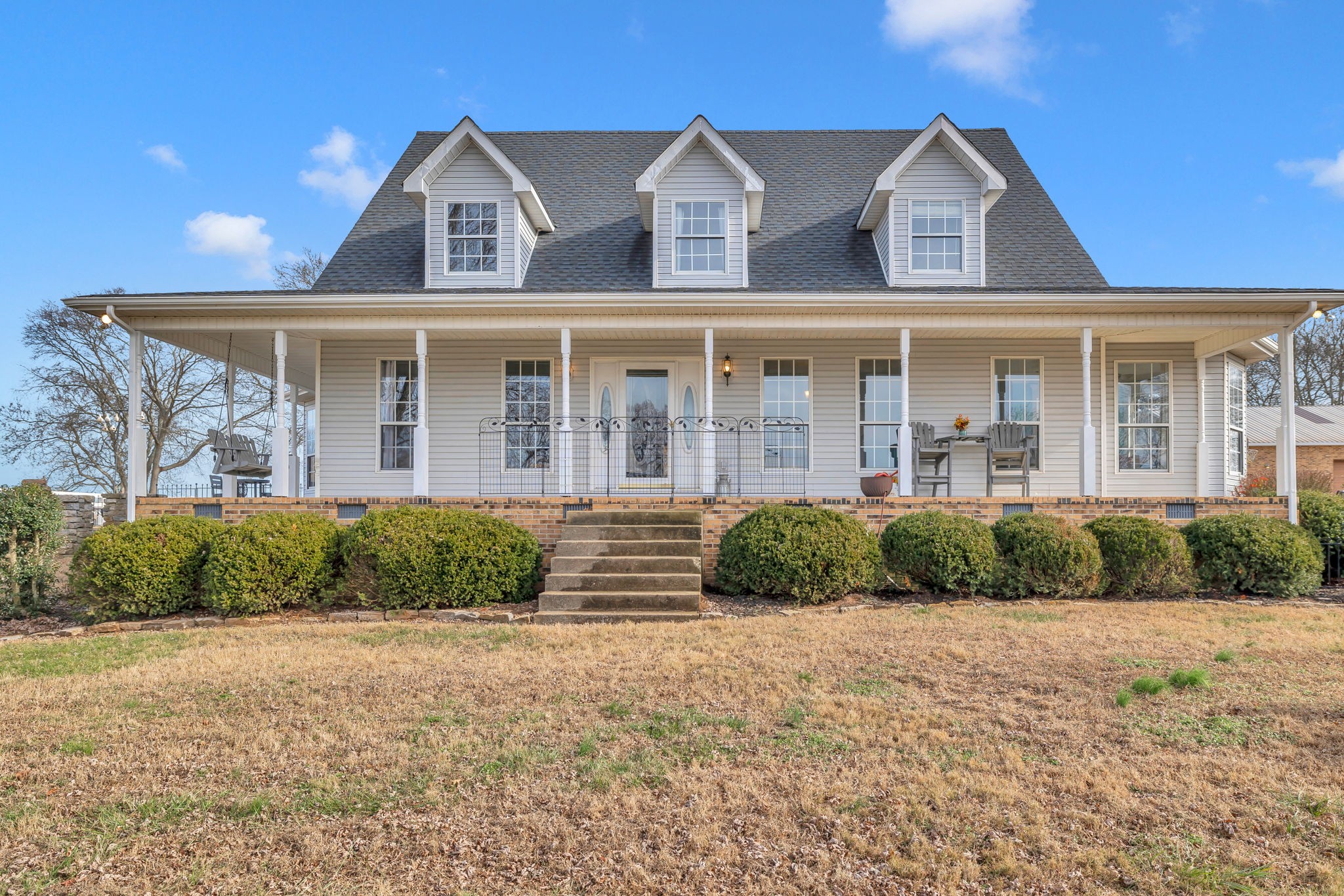 a front view of a house with a yard