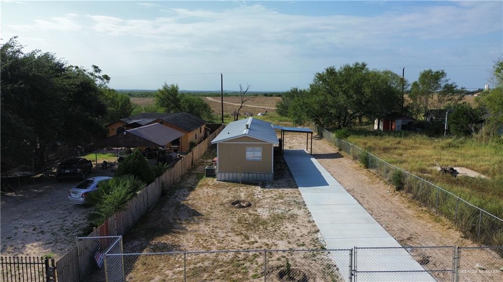 a view of a pathway with a yard