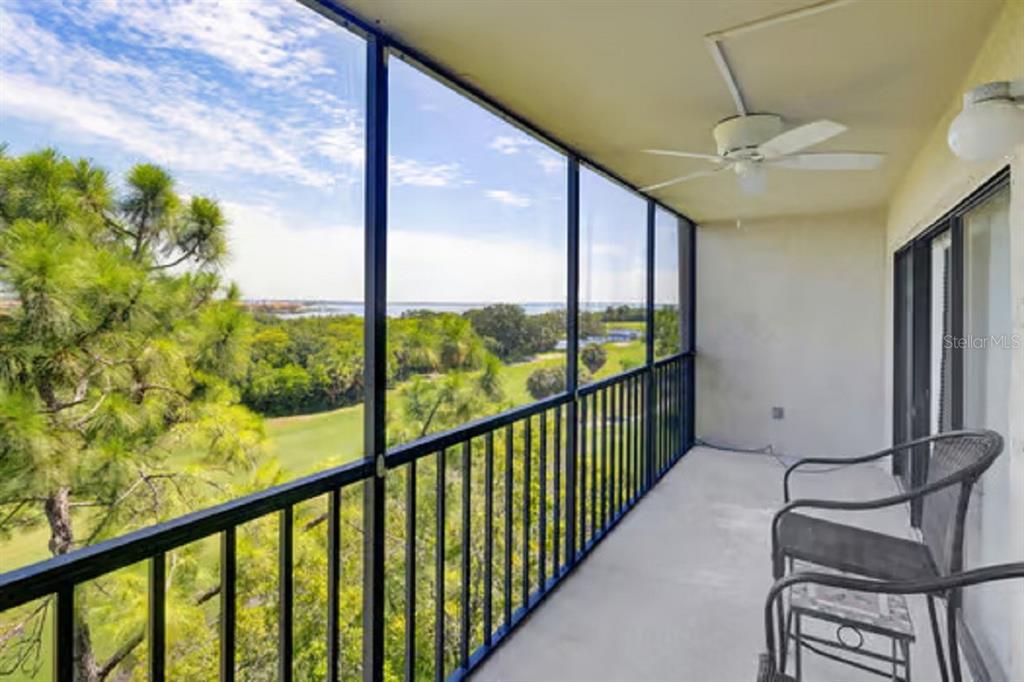 a view of balcony with furniture