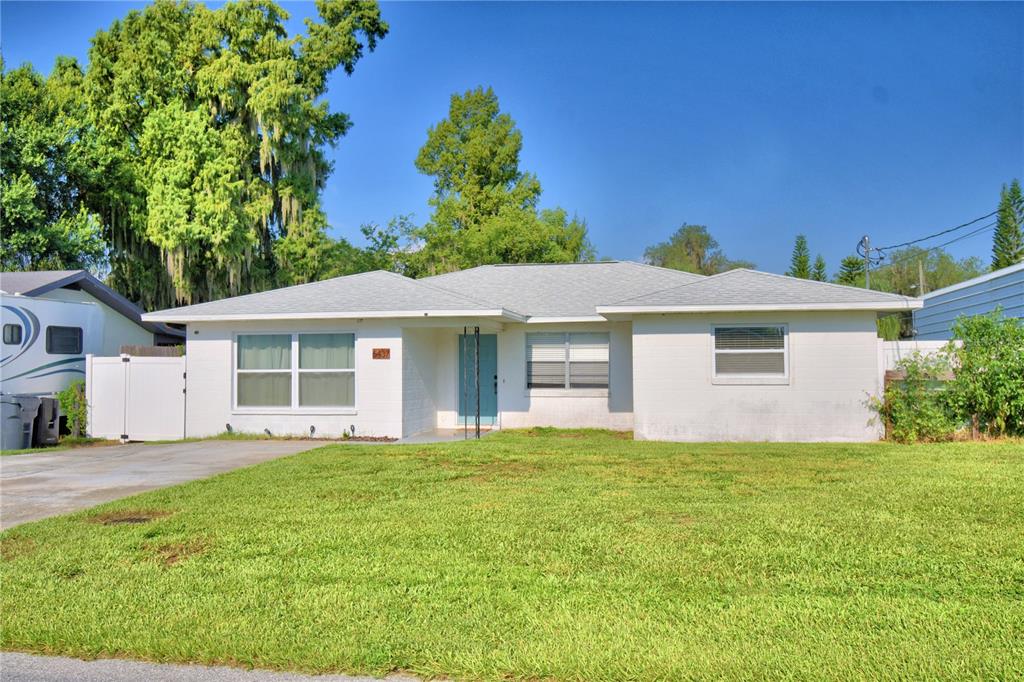 a front view of a house with a yard