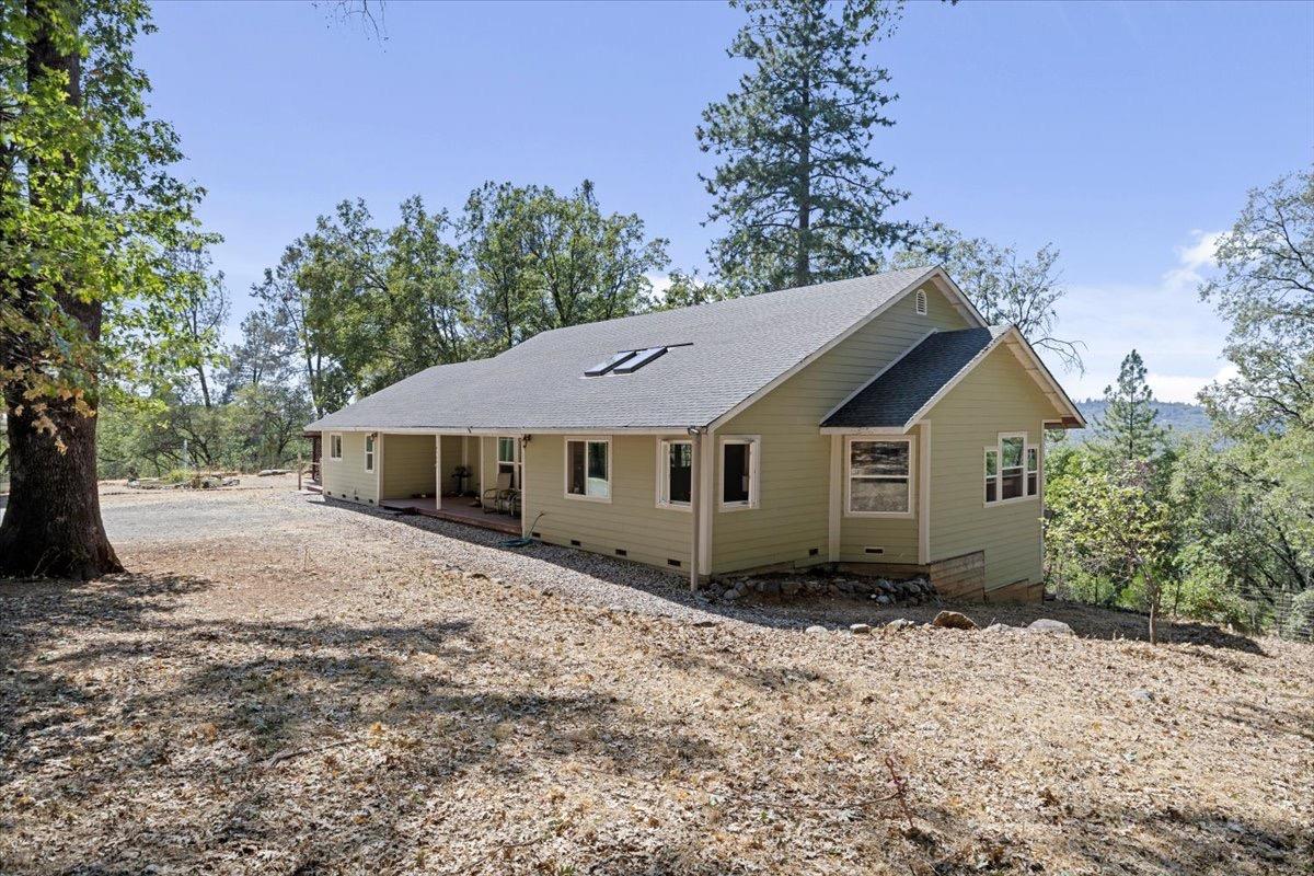 a house with trees in the background