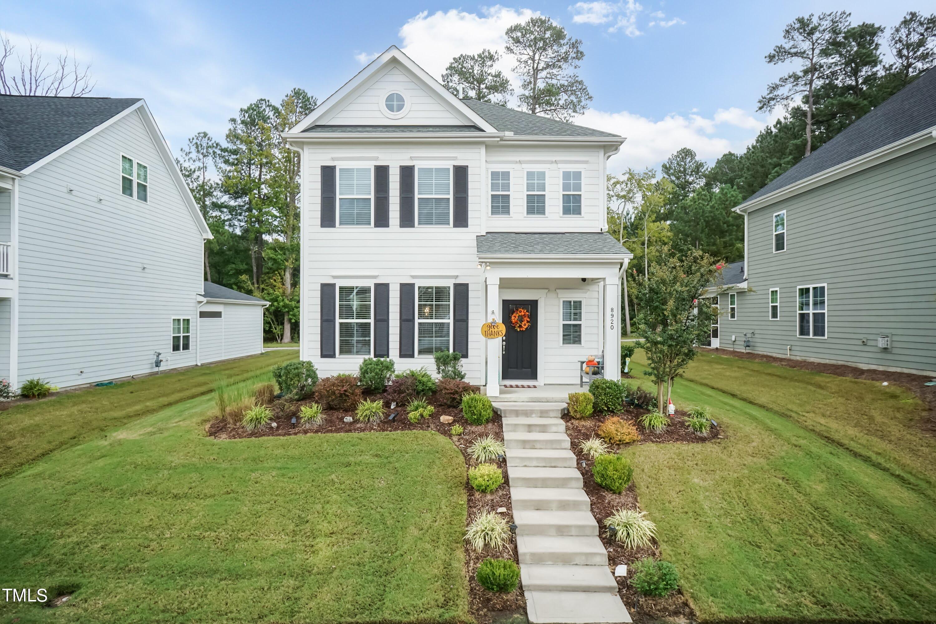 a front view of a house with a yard