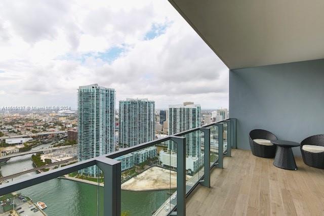 a view of a balcony with city view