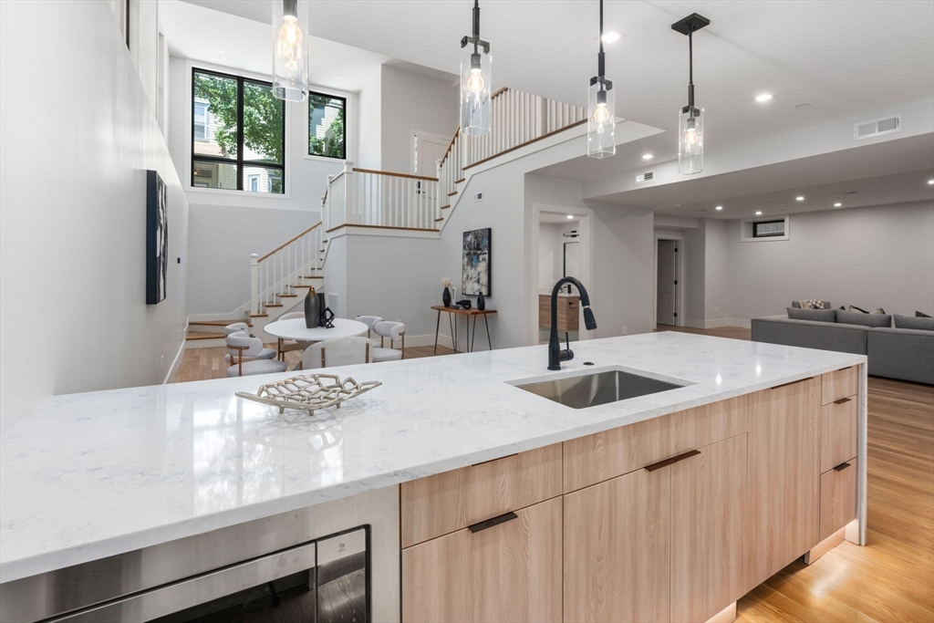 a kitchen with a sink and a refrigerator