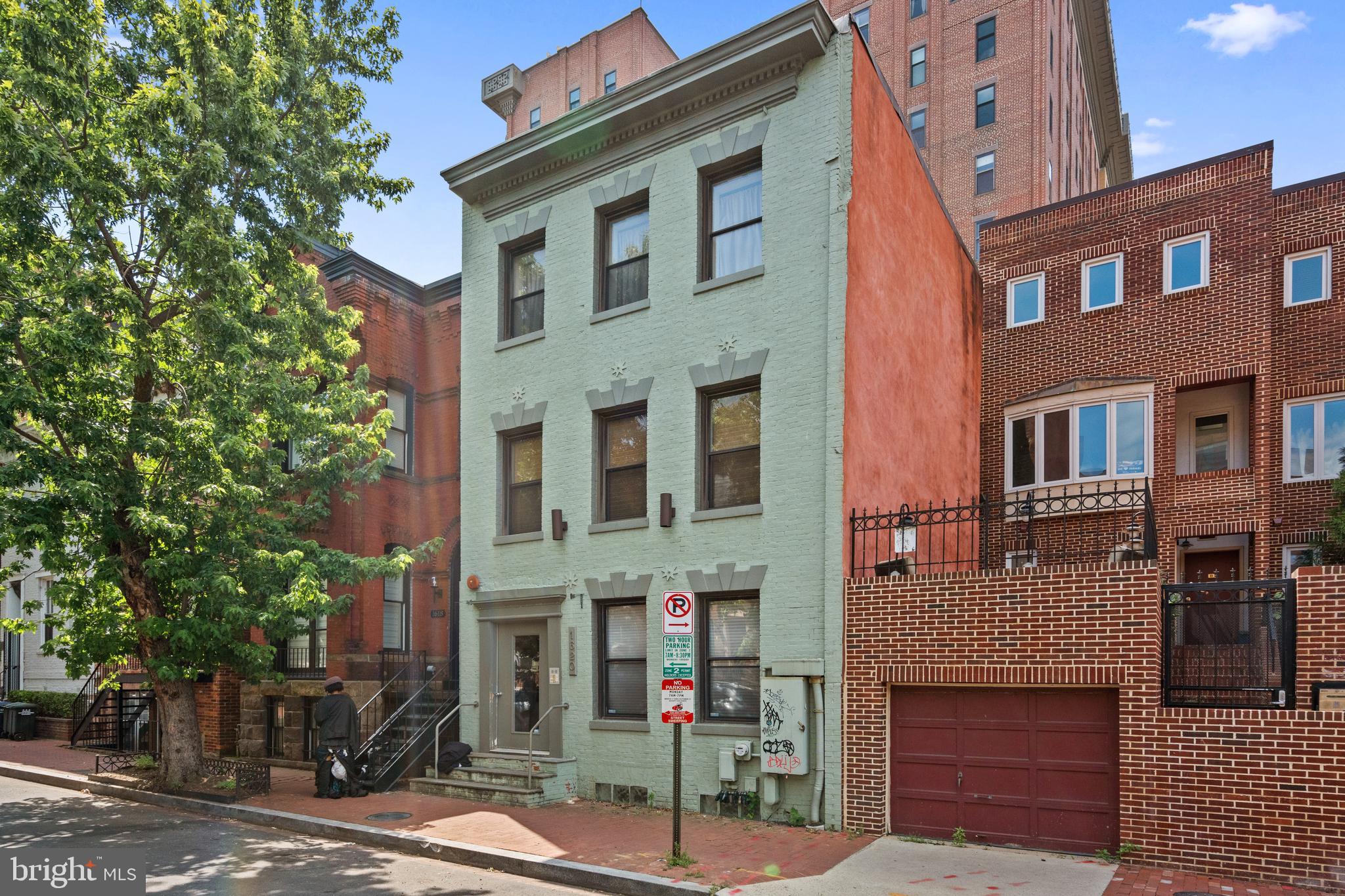 a front view of a building with street view