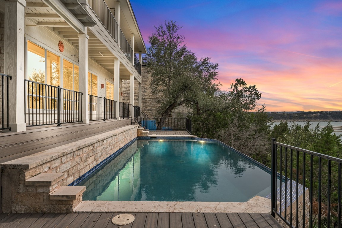 a view of a balcony with a swimming pool