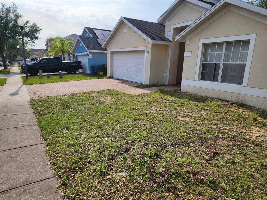 front view of a house with a yard