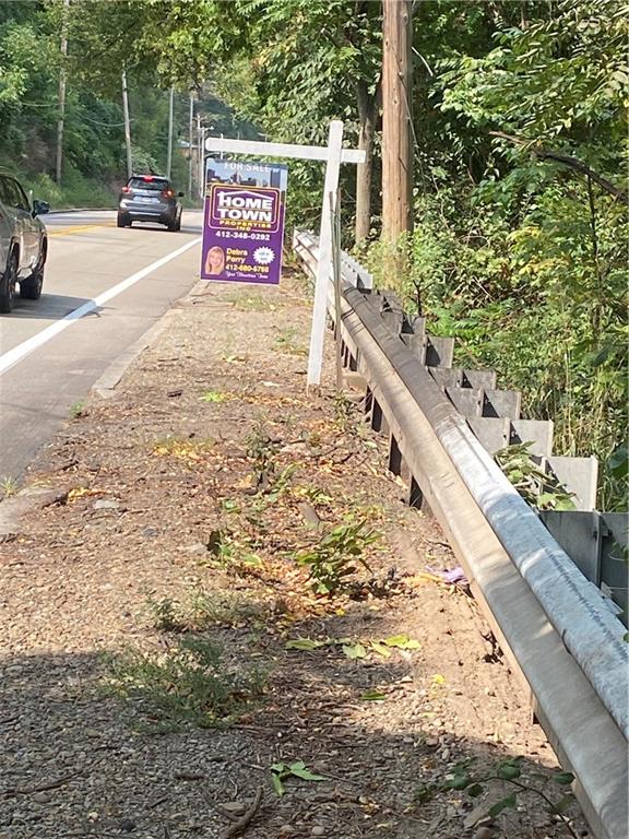 a view of sign board with street