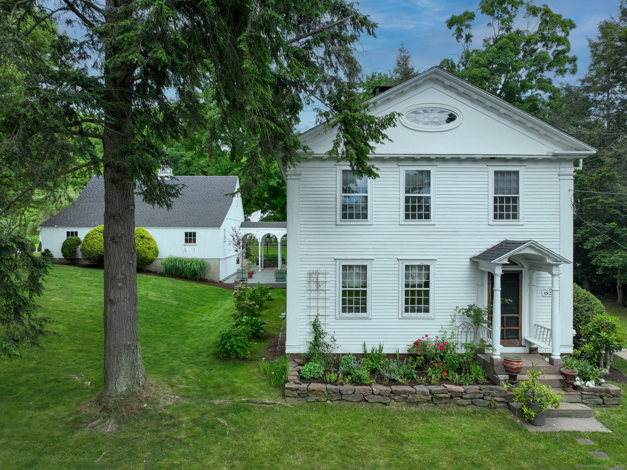 a front view of a house with a yard