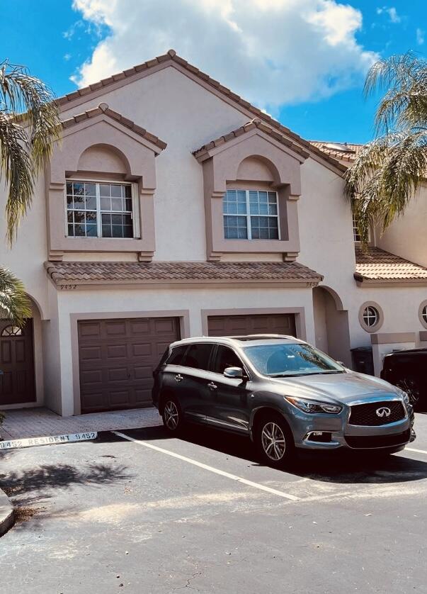 a view of a car parked in front of a house