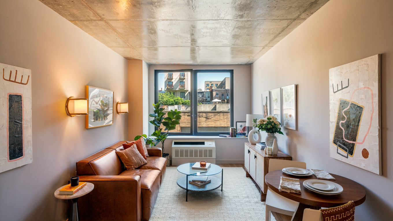 a living room with furniture and a large window