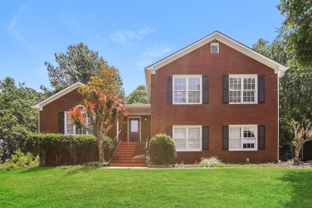 front view of a house with a yard