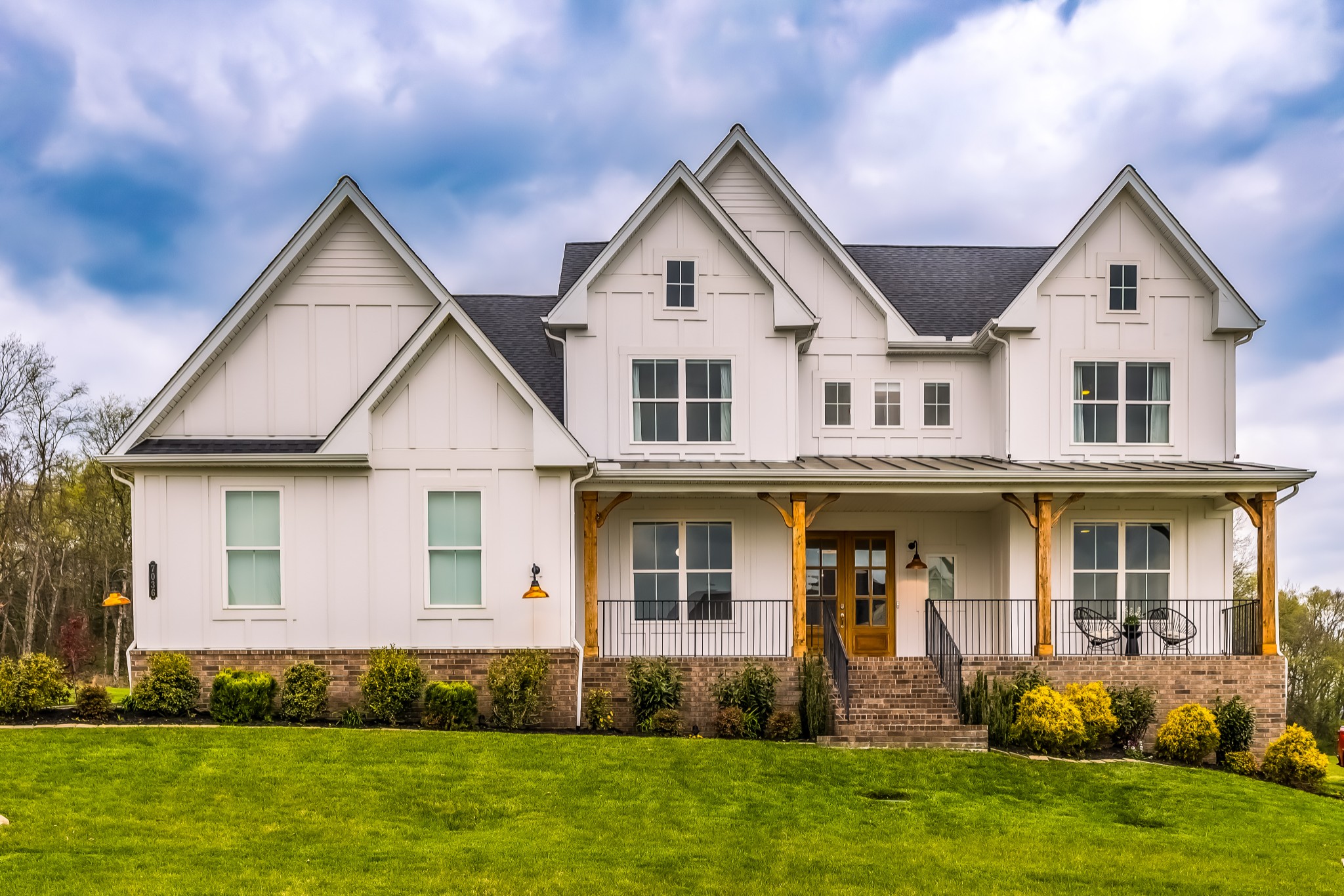 a front view of a house with a yard