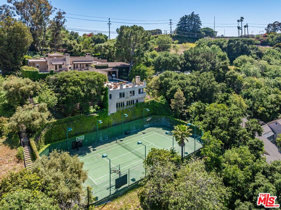 an aerial view of a house with yard swimming pool and outdoor seating