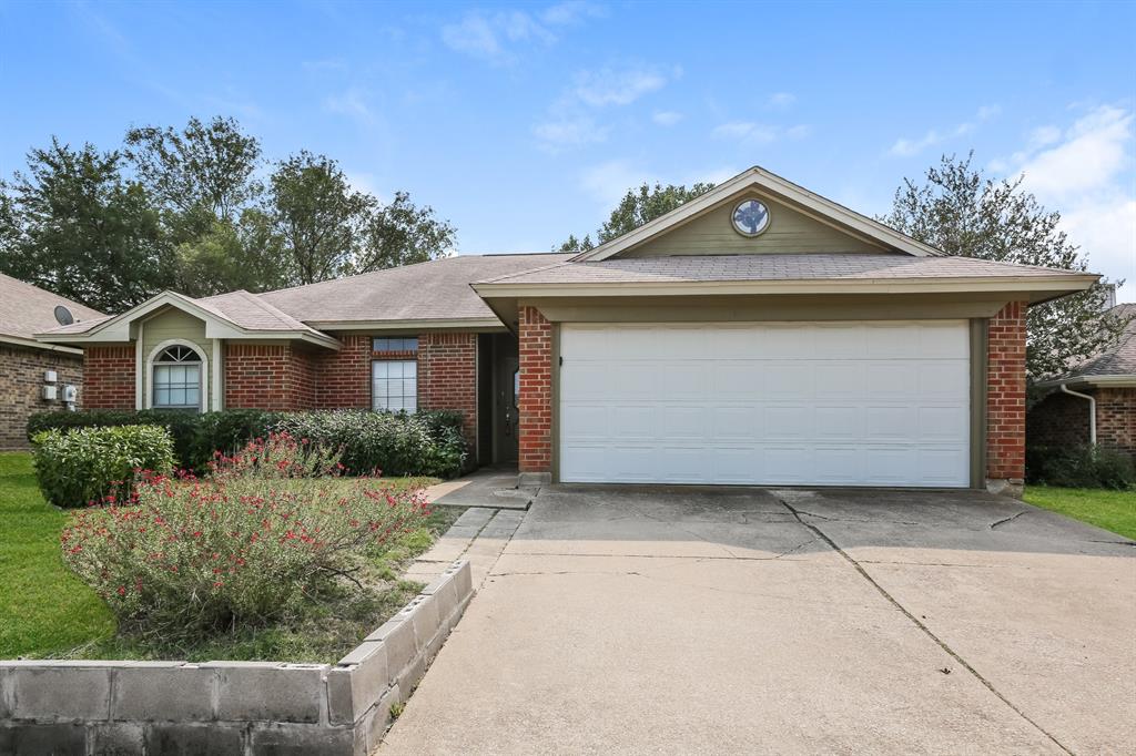 a front view of a house with yard