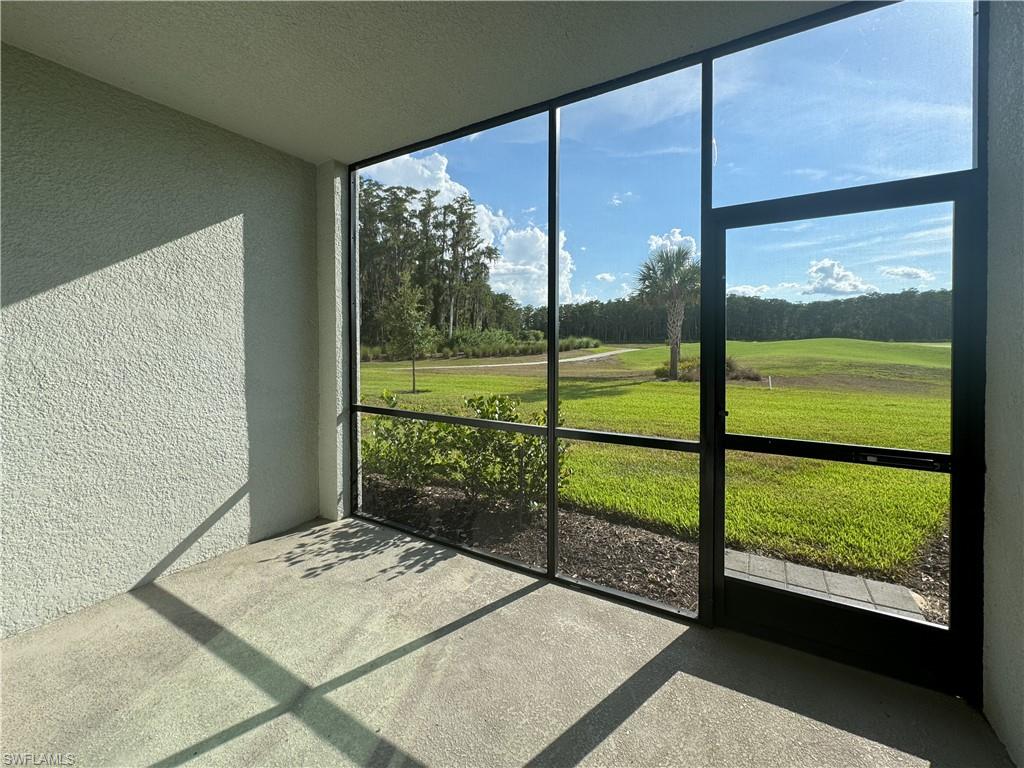 a view of a room with yard from a window