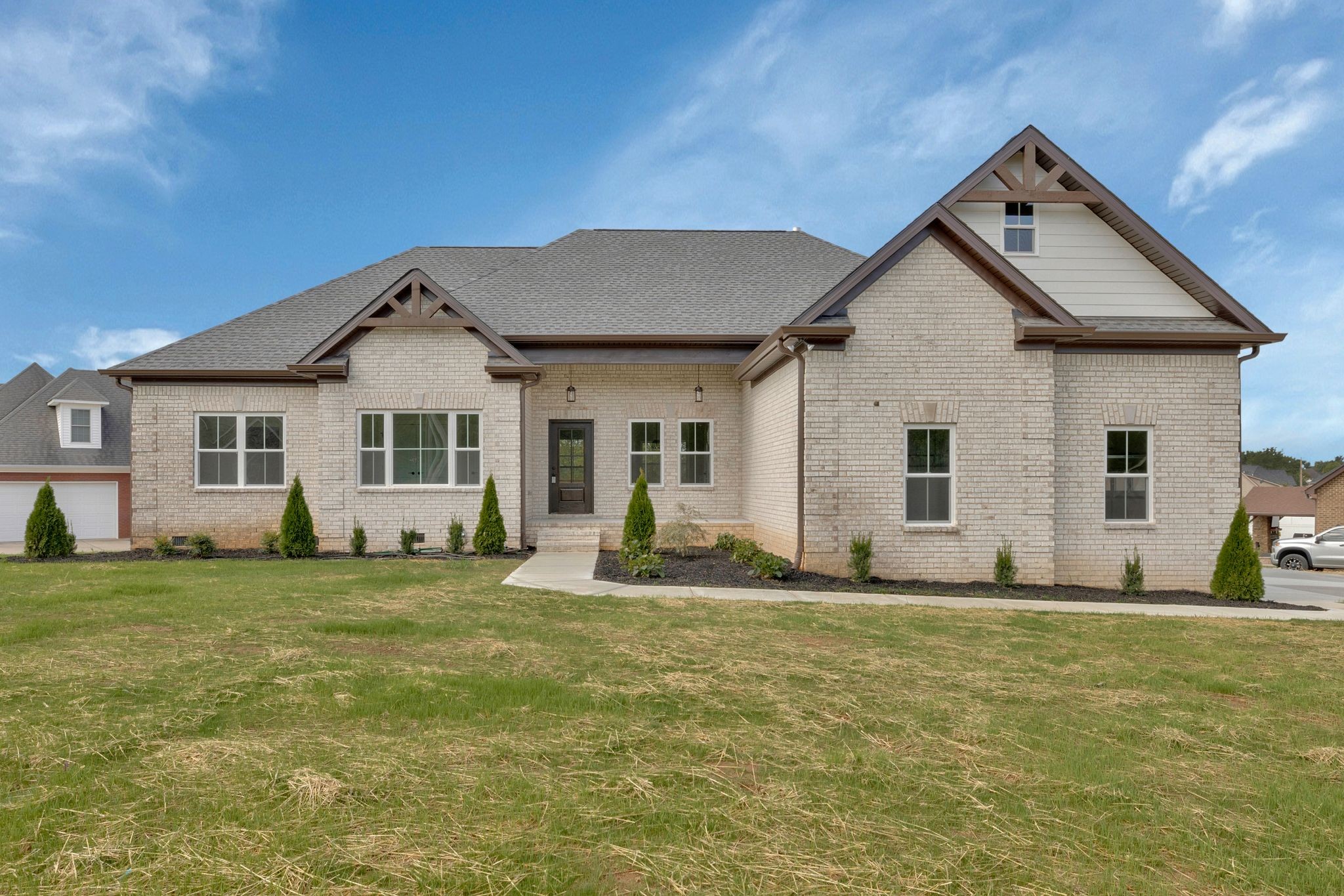 a front view of a house with a yard