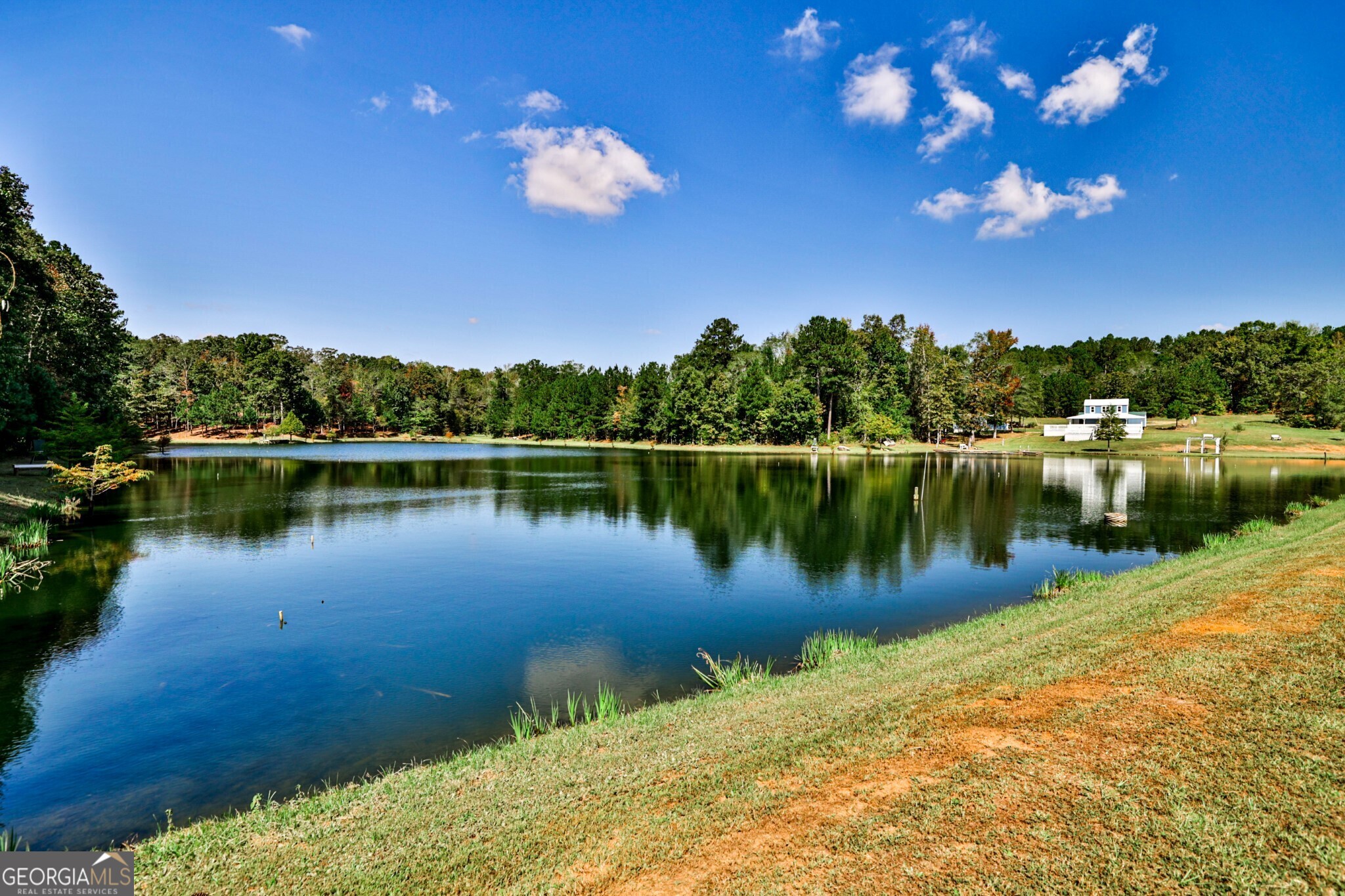 a view of a lake in middle of a house with a lake view