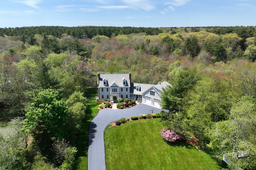 an aerial view of a house with a garden