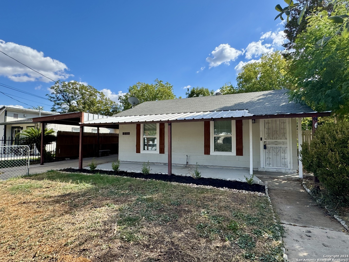 front view of a house with a yard