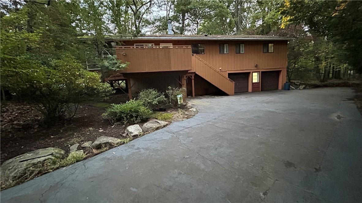 View of front facade featuring a garage