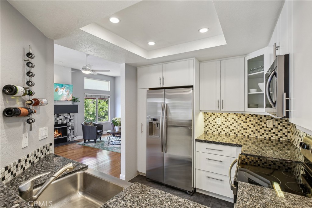 a kitchen with a sink and refrigerator