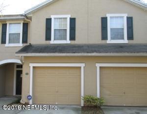 a front view of a house with a garage