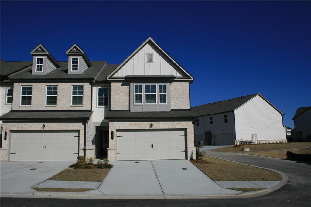 a view of house with yard