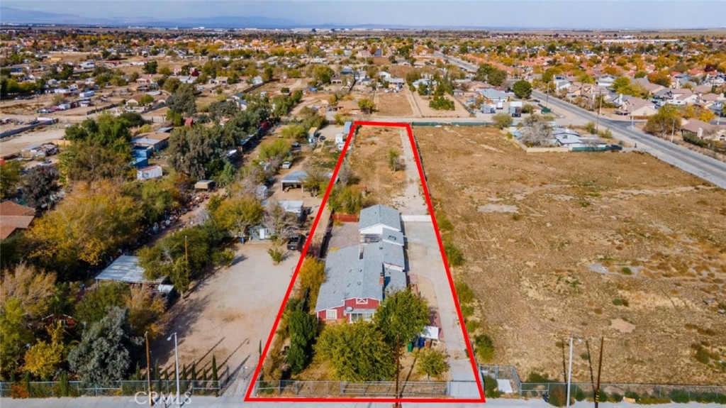 an aerial view of house with yard