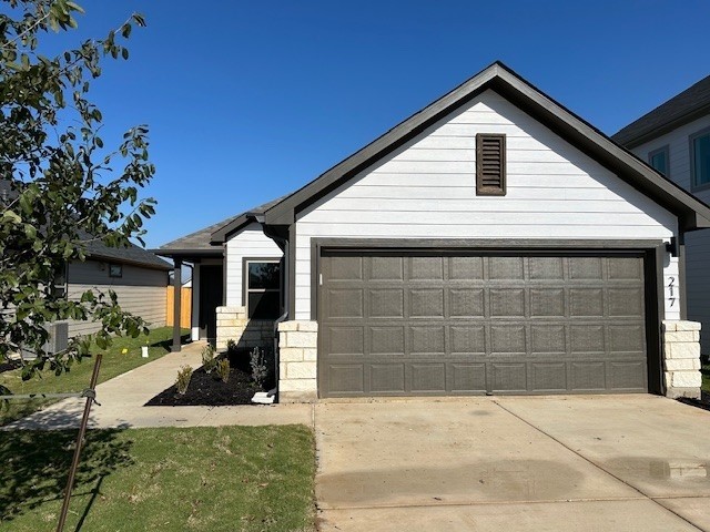 a front view of a house with garage