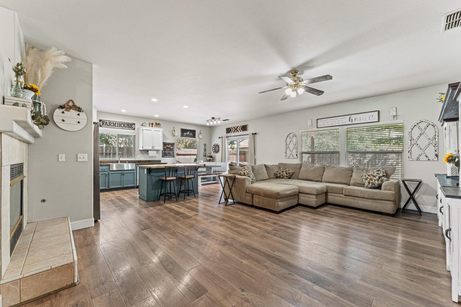 a living room with furniture and kitchen view