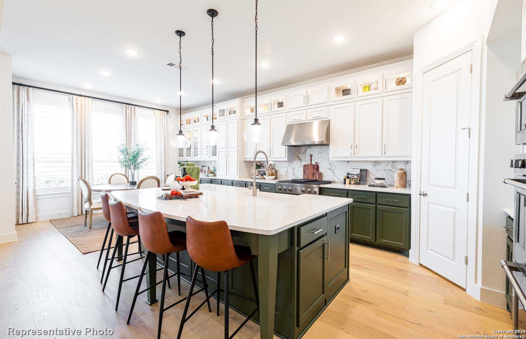 a kitchen with stainless steel appliances kitchen island a large island in the center