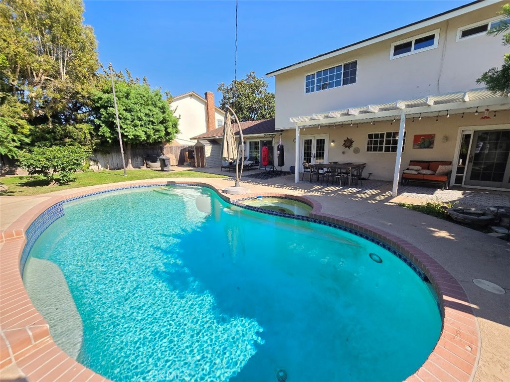 a view of a swimming pool with lounge chair