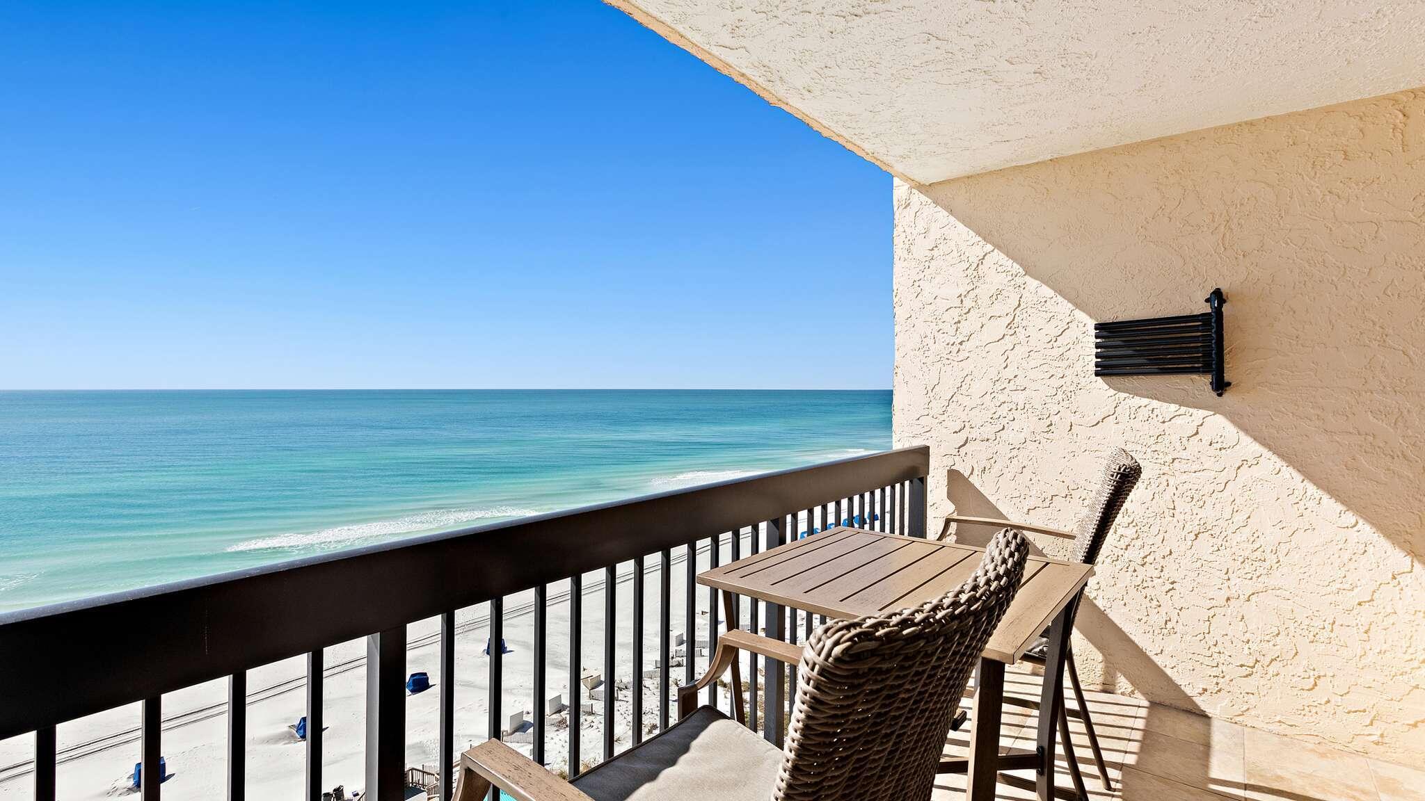 a view of a balcony with an ocean