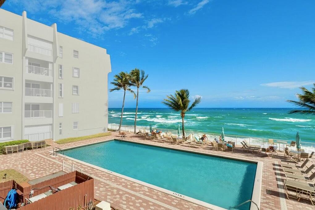 view of a pool with a patio