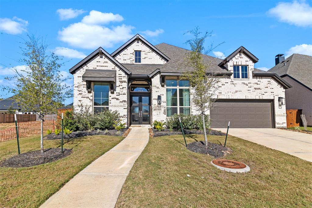 Stunning home built by Highland Homes in 2023.  It has a three car tandem garage and double wide driveway.