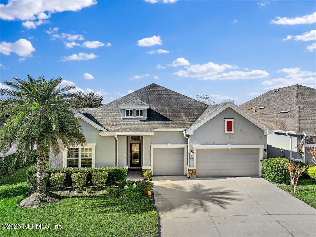 front view of a house with a yard