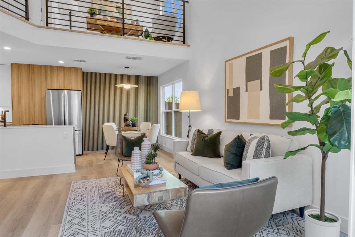 a living room with furniture and a potted plant