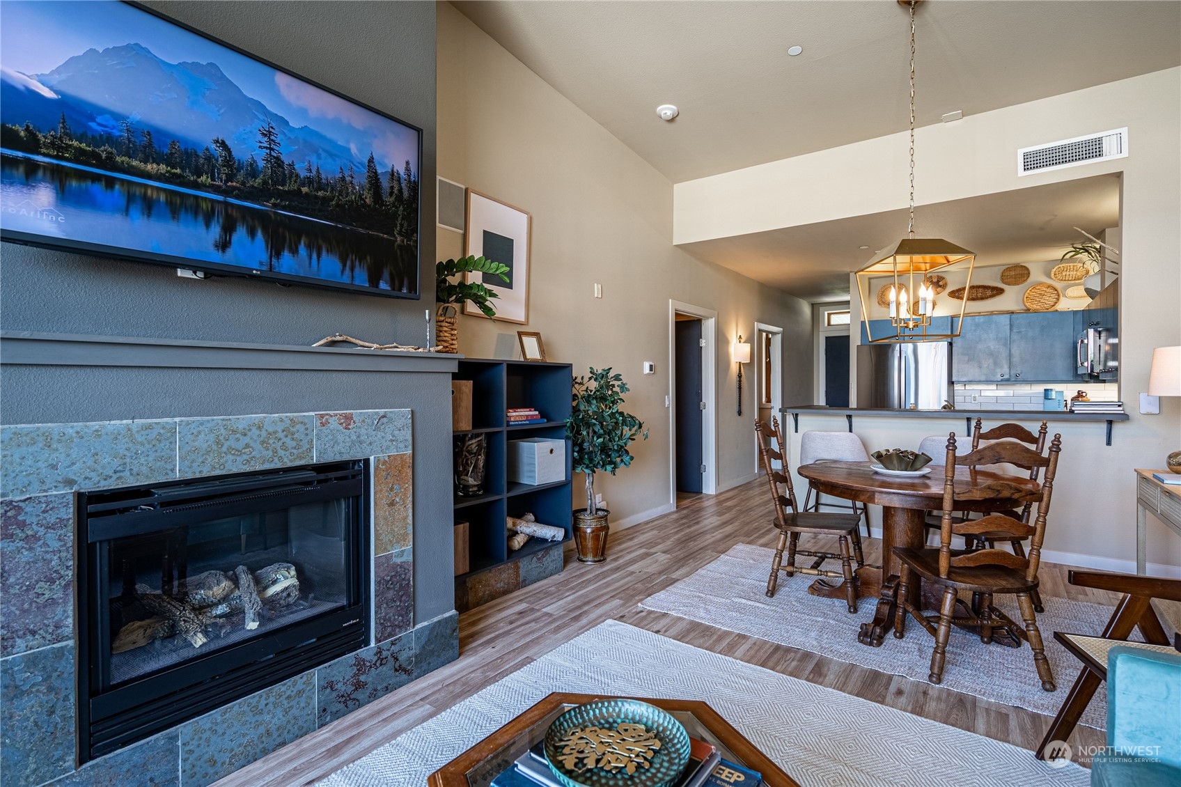 a living room with furniture a fireplace and a fireplace