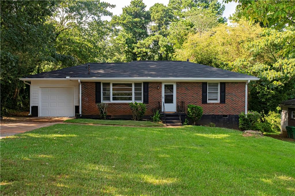 a house view with a sitting space and garden