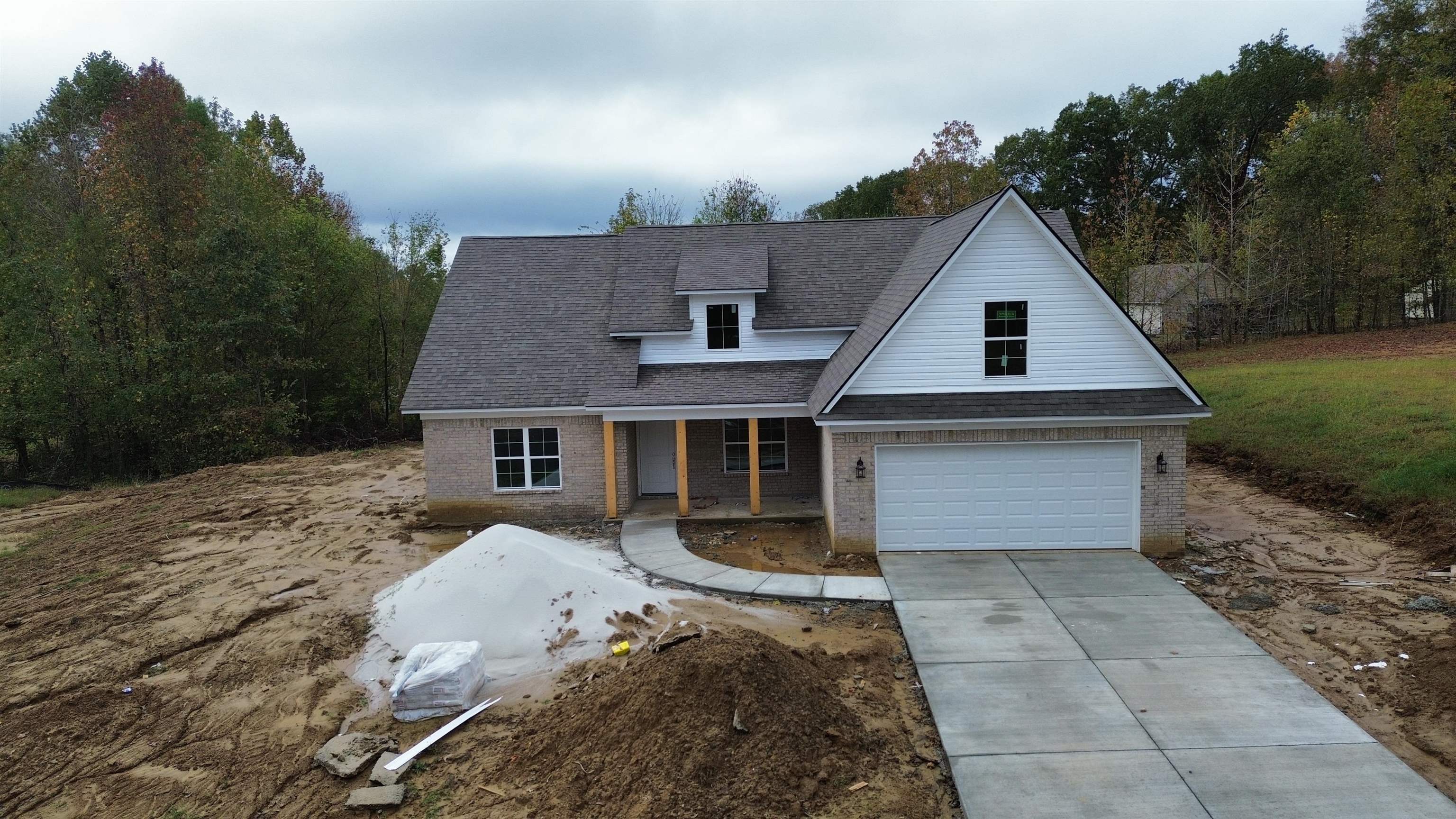 a front view of a house with yard