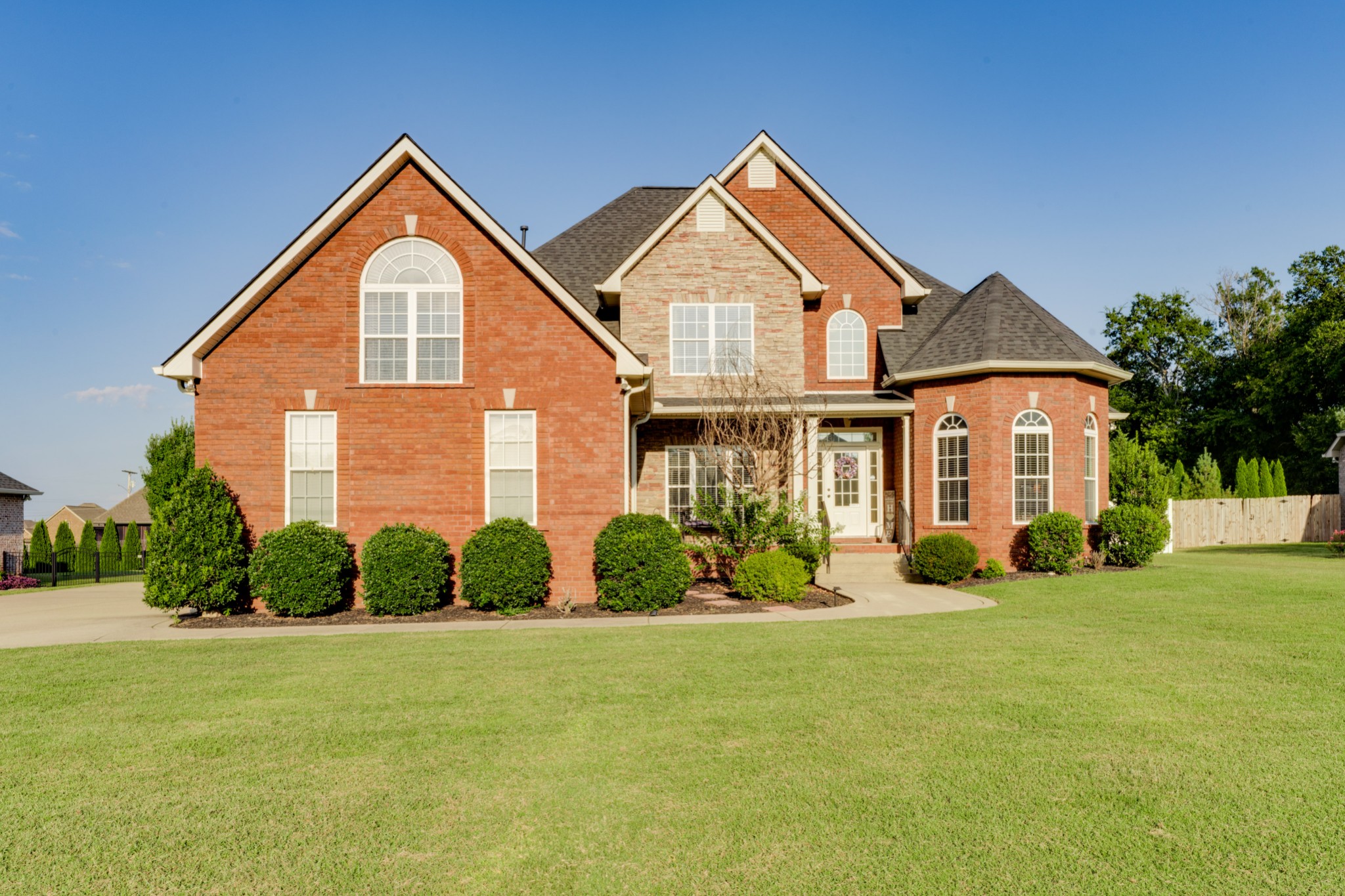 a front view of a house with a yard