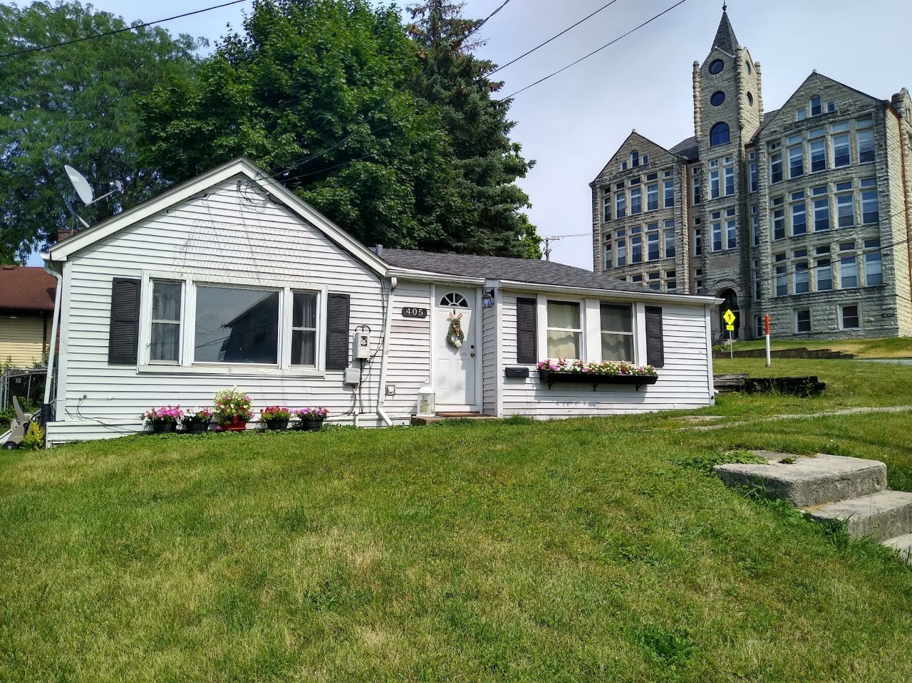 a front view of a house with a yard