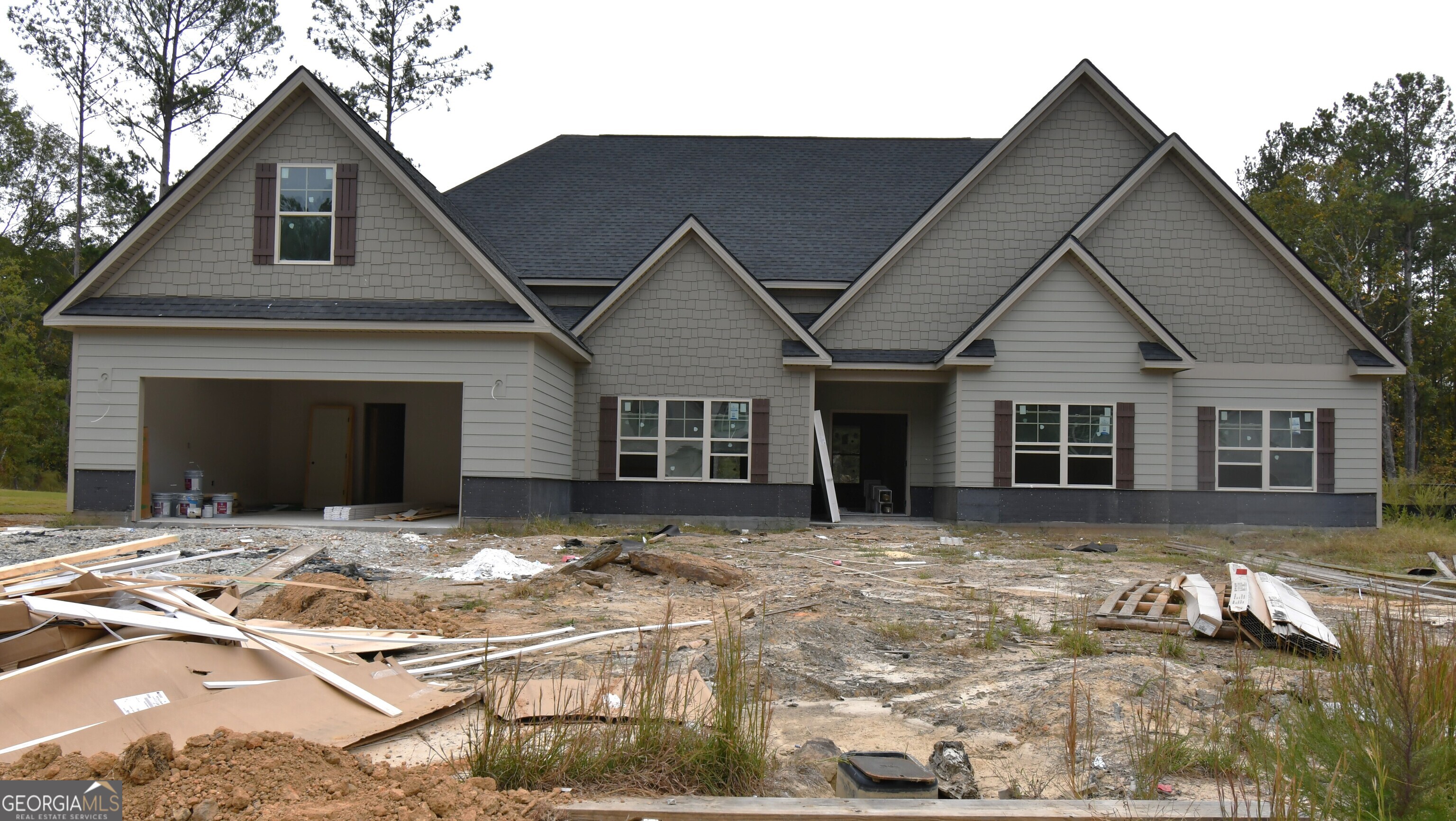 a front view of a house with yard