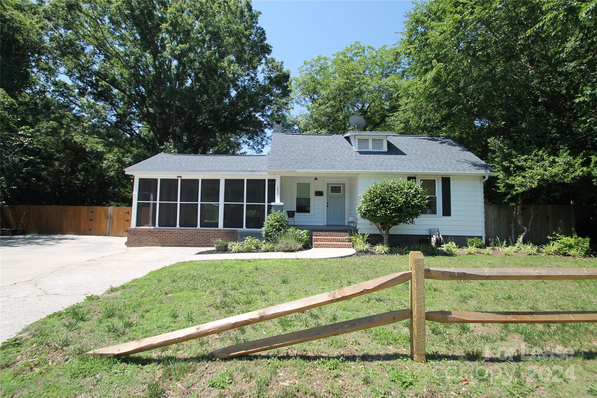 front view of a house with a yard